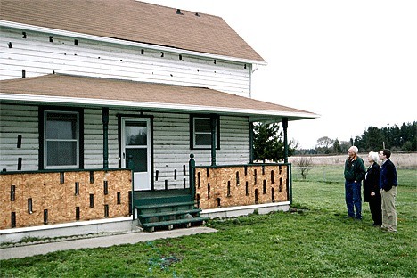 Irene Tyhuis (center) visits the farmhouse at NAS Whidbey Island's Outlying Field Coupeville where she spent many childhood days. Her grandfather
