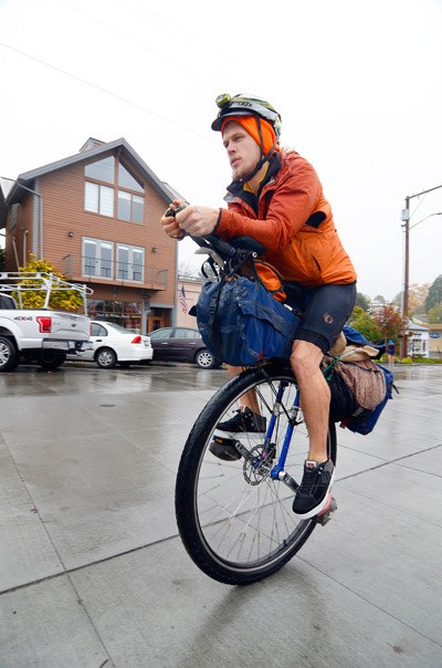 Cary Gray pedals up Second Street in Langley. He’s preparing to leave town in December
