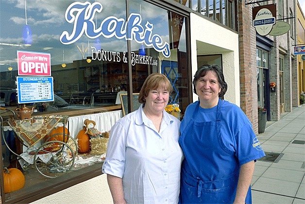 Karen Hossfeld and Dianne Varshock stand in front of Kakies Donuts and Bakery