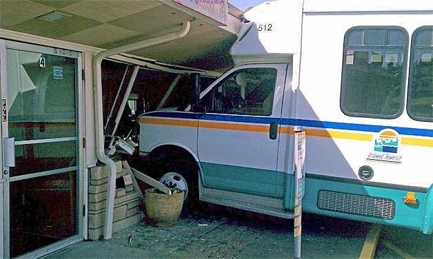 An Island Transit bus crashed through the front of a Midway Boulevard business Wednesday morning.