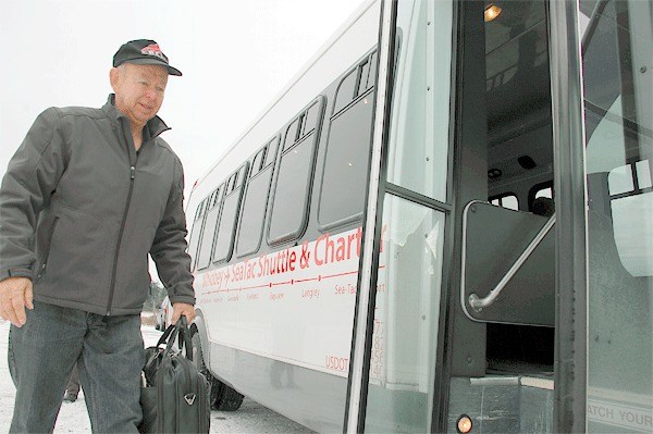 Coupeville resident Mike Glenn boards a Whidbey SeaTac Shuttle the day before Thanksgiving. Starting tomorrow