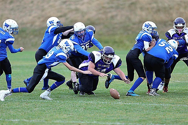 Oak Harbor recovers a fumble during Saturday's action.