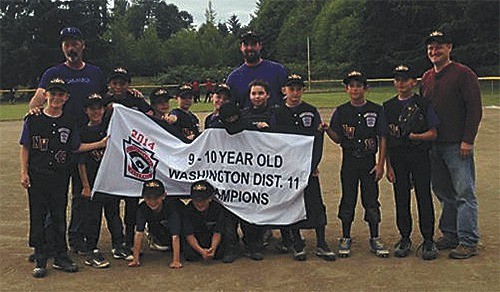 The North Whidbey Little League 9/10 baseball team displays its championship banner Thursday after defeating Central Whidbey.