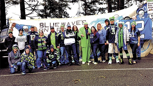 A group of Seahawks fans assemble near Deception Pass bridge Saturday during a rally.