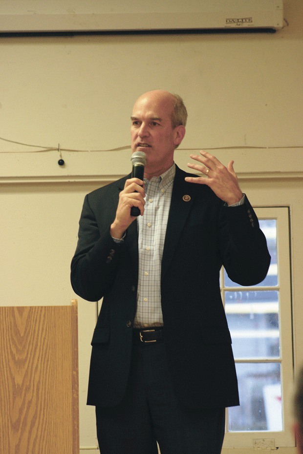 Congressman Rick Larsen speaks to a crowd Tuesday at the Coupeville Rec Hall.