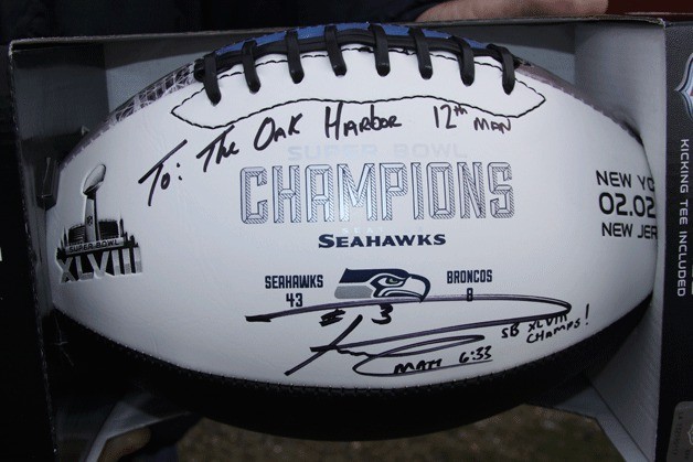 A football signed by Seattle Seahawks quarterback Russell Wilson was auctioned off for $5