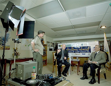 Jim Riney talks with Mayor Jim Slowik and City Administrator Paul Schmidt before the taping of a new Channel 10 segment called “Municipal Issues.”