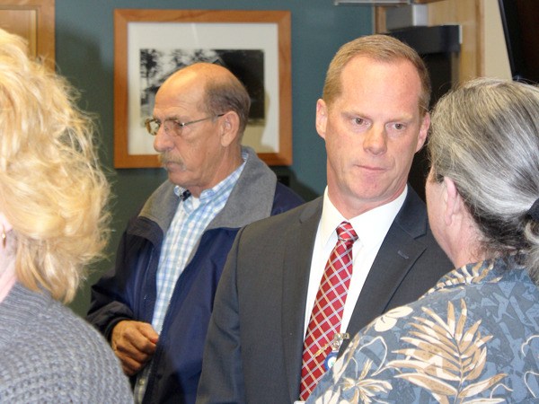 Mike Nortier chats with a member of the public during a meet and greet with prospective directorial candidates last month. The board unanimously chose Nortier for the position.