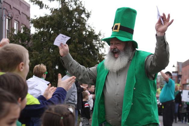 A parade participant makes his way along Pioneer Way during the 42nd Oak Harbor St. Patrick's Day parade Tuesday