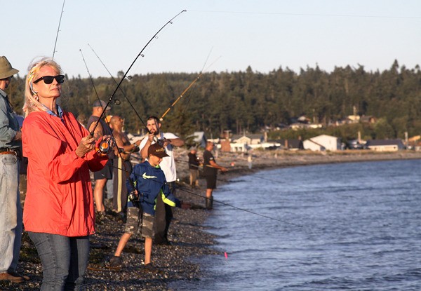 Salmon anglers line the beach Wednesday night at the Keystone spit