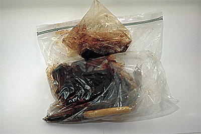 Investigators found 1.5 pounds of tar heroin while serving a search warrant on a Coupeville home.