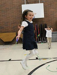 Second-grader Caidence Meadors participates in Oak Harbor Elementary’s jumpathon Friday to raise money for technology and other projects.