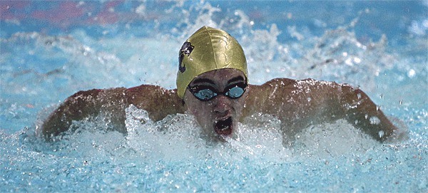 Caley Power races in the butterfly in Oak Harbor's win over Everett.