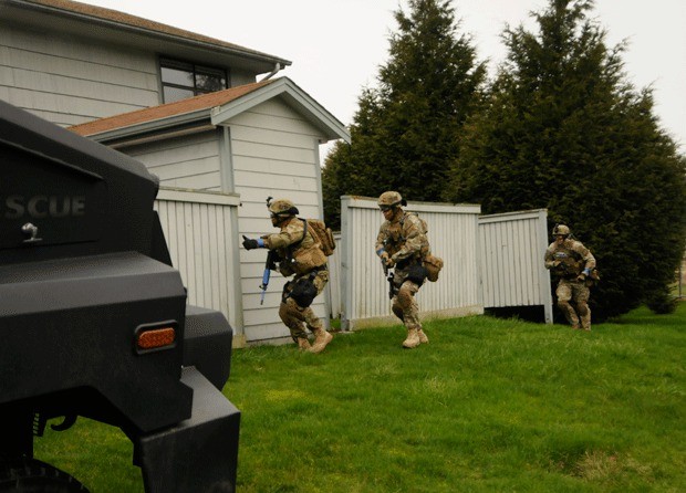 The Washington State patrol team prepares to conduct an entry during a barricaded hostage scenario in last year’s exercise.