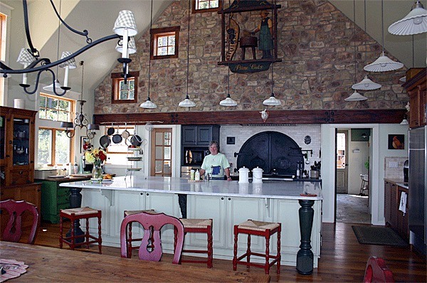 Diane Billingsley stands in the kitchen of her Greenbank home.  Billingsley decorated the space with antiques that she collected from her travels.