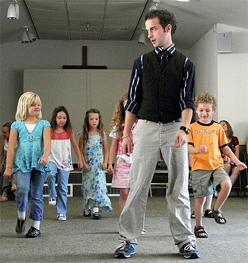 Missoula Children’s Theatre director John-Thomas Appling leads kids in a dance audition for “The Princess and the Pea.”