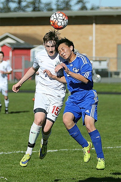 Coupeville's Ethan Spark goes head to head with a Bellevue Christian player in Wednesday's match.