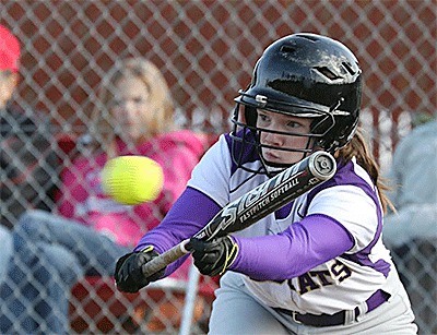 Liz Adams drops down a bunt for Oak Harbor Monday.