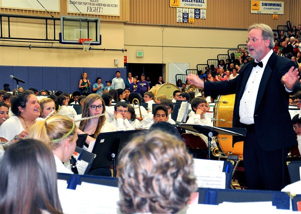 Bruce Lantz leads his band at a recent concert. He is retiring after 31 years.