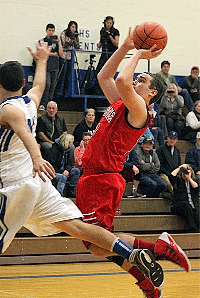 Coupeville's Aaron Trumbull shoots on the run at South Whidbey Tuesday.