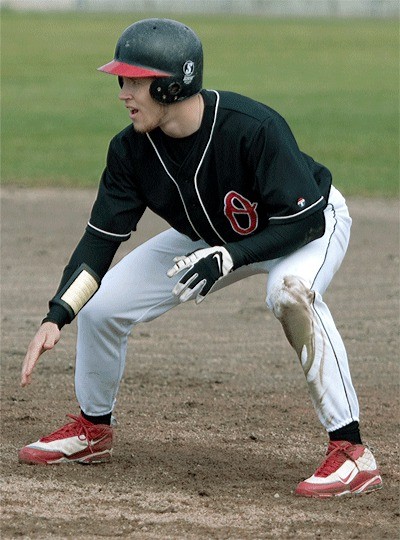 Oak Harbor’s Chris Reilly takes a lead  for the Olympic CC baseball team.