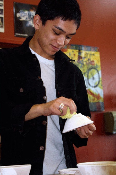 Pottery X student Andrian Jimenez puts finishing touches on a bowl on March 25 in Frank Jacques' class at Oak Harbor High School.