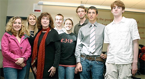 Advisor Barbara Ballard stands with National Honor Society students Laura Chan