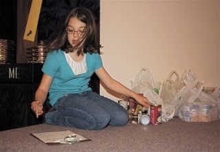 Samantha Cook carefully tallies the number of donations Sunday morning before the 11 a.m. service at the Church of Christ.