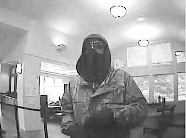 Surveillance video from Wells Fargo bank in Clinton shows a bank-robbery suspect.