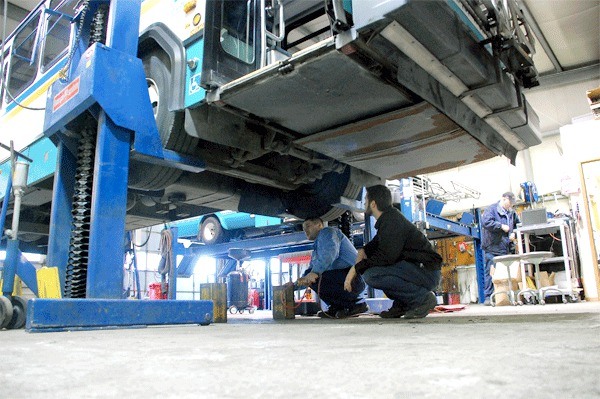 Island Transit mechanics Josh McNamara and Michael Matros look at the undercarriage of a bus in one of two maintenance bays in the transit organization’s Central Whidbey facility. The board of directors will consider next week whether to borrow $22.4 million to pay for a new facility.