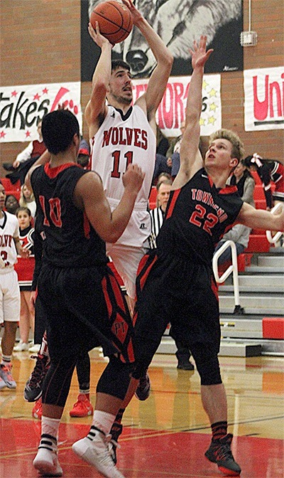 Ryan Griggs shoots over the Port Townsend defense in Tuesday's game.