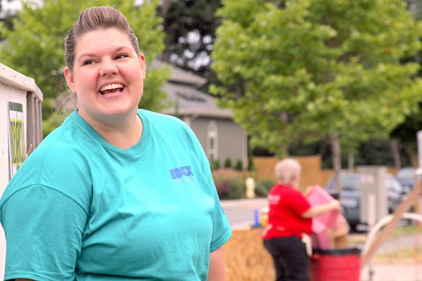 Melissa Brown is all smiles at the construction site in Oak Harbor where Habitat for Humanity of Island County is building her a home with help from IDEX Health & Science.