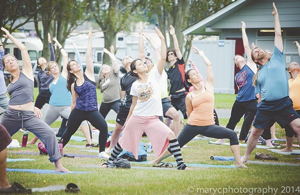 Attendees pose during YogaFest 2013