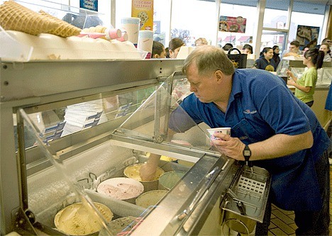 Rex Nickerson scoops ice cream Wednesday evening during Baskin-Robbins’ “31 Cent Scoop Night.” The Oak Harbor ice cream parlor sold more then 1