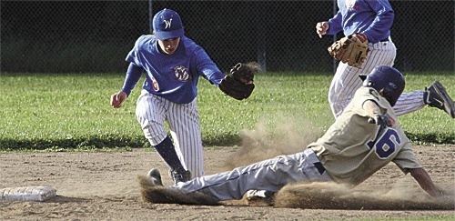 Clay Doughty steals second in Oak Harbor's 12-2 win over Sedro-Woolley.