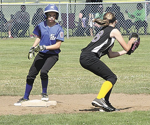 Central/South Whidbey's Maya Toomey-Stout reaches second base before North Whidbey shortstop Kaylee Andersen can apply the tag.