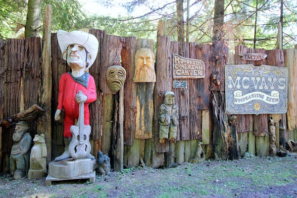 Steve Backus is turning heads as people drive by his four-acre gated compound in Clinton. Backus is a chainsaw artist and has decorated the outside of his property with his eclectic artwork.