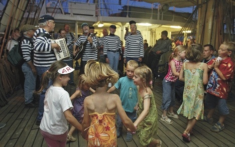 French children dance to Shifty Sailor music on the Russian sailing ship Mir on Bastille Day.