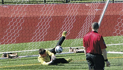 Kevin Silveira blocks a shot in the shootout to set up Oak Harbor's win.