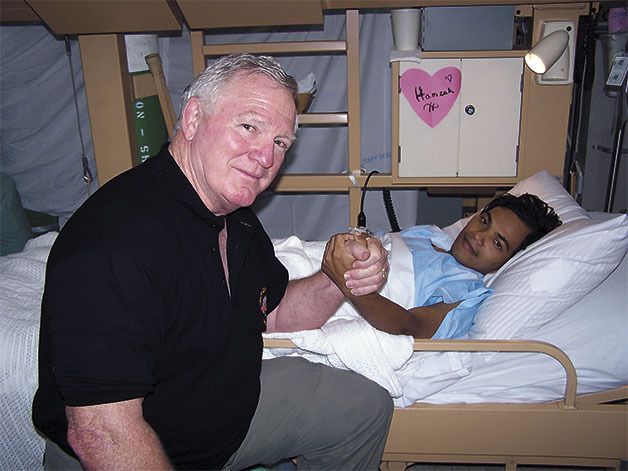 Bill McDaniel spends time getting to know many patients aboard the USNS Mercy while it was stationed in Indonesia in 2005. McDaniel joined efforts to provide aid to those injured by the tsunami and earthquake in the area.