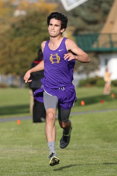 Tyler Grehan runs to the finish line to help the Wildcat boys team place second in the meet.