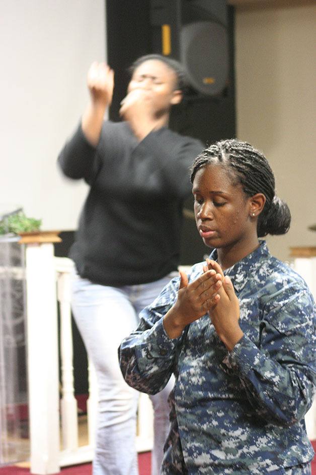 Medlyne Alexis prayer dances with Mimi Daviter in the background as members of the Mission Ministry Outreach Thursday in preparation for the Martin Luther King Jr. celebration 3:30 p.m. Sunday.