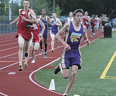 Oak Harbor's John Rodeheffer leads the pack on the way to winning the district 3