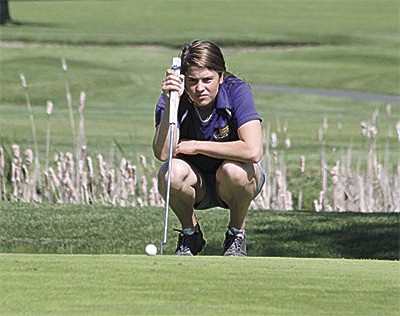 Joanna Leete sizes up a putt earlier this season. The Oak Harbor senior placed sixth in the state 3A tournament this week.