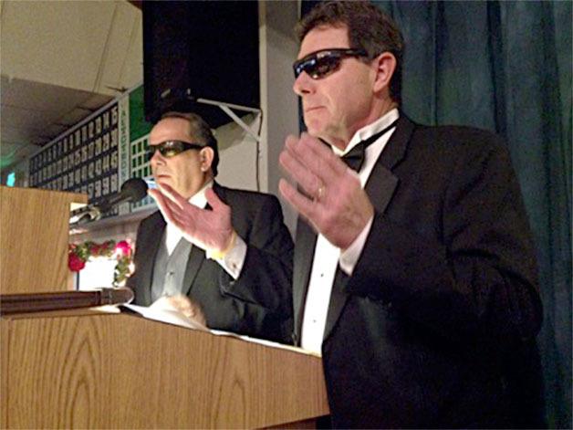 Oak Harbor attorney Chris Skinner and City Councilman Bob Severns serve as emcees of the 15th annual OHscars Friday. This year’s event featured a James Bond theme.