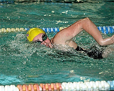 Mollie Briddell swims to first in the 100 freestyle Monday. She celebrated Senior Night with additional wins in three other events.