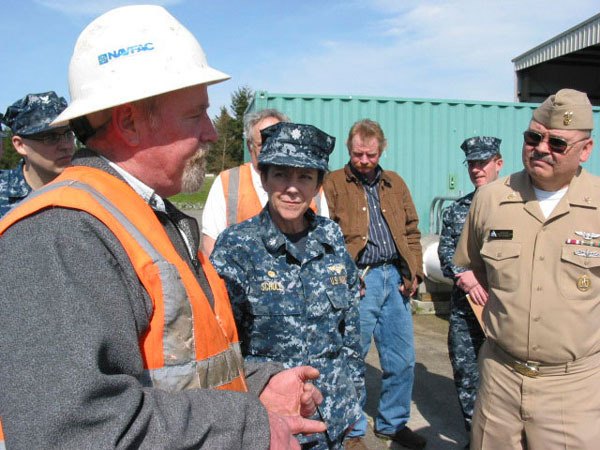 Members of FRCNW's Green Team coordinate during a tour of the command's composting facility. From left