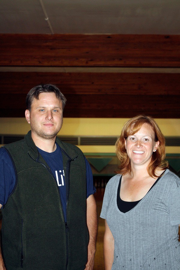 Siblings Matt Iverson and Mimi Johnson stand in front of their six bowling lanes at Ebey Bowl.  The pair has renovated the facility and hope to reopen it in August after a 10-year closure.