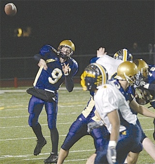 Oak Harbor High School graduate Marshall Lobbestael gets off a pass in a 2006 playoff game against Mariner.