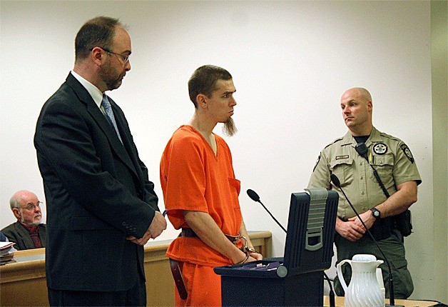 Ryan Parish stands in court Monday next to his attorney